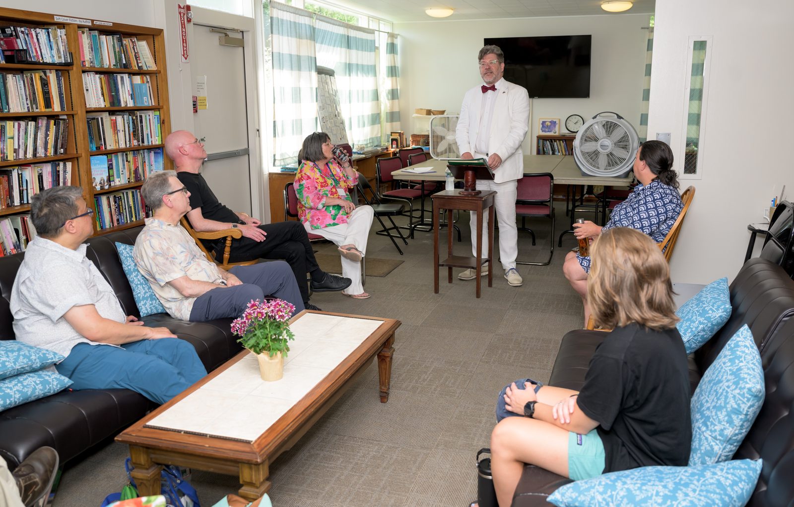Robert Dimmick reads to a seated audience during his talk on letter writing.