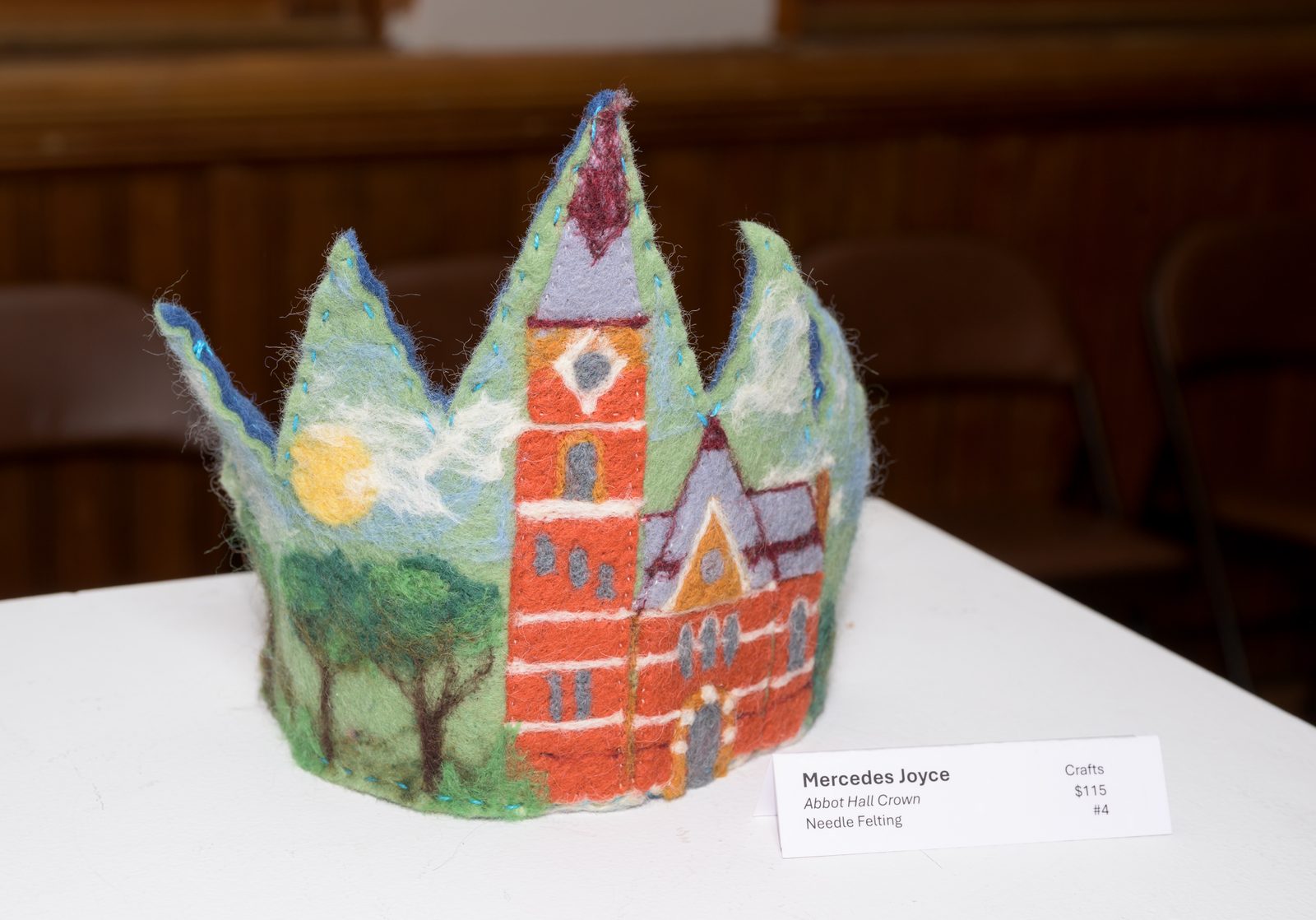 A needle-felted crown depicting Abbot Hall, labeled as the work of Mercedes Joyce and priced at $115, in the crafts exhibit.