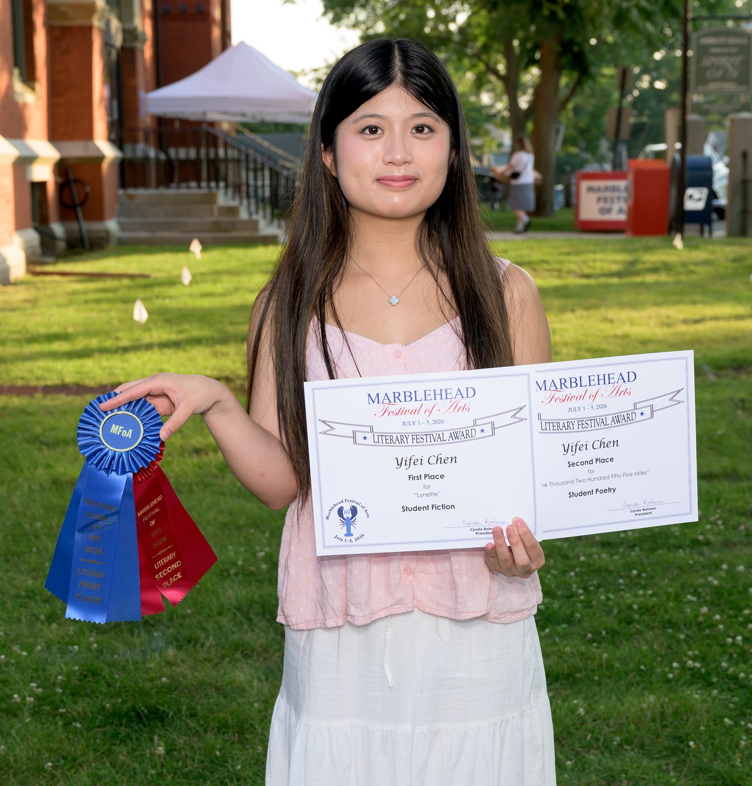 Yifei Chen displays her first-place Student Fiction award for ‘Lynette’ and a second-place Student Poetry award.