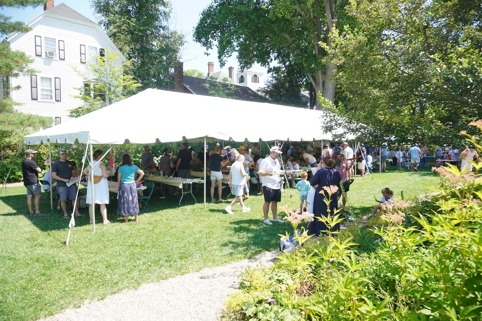 The boat-building tent fills the garden of the Jeremiah Lee Mansion.